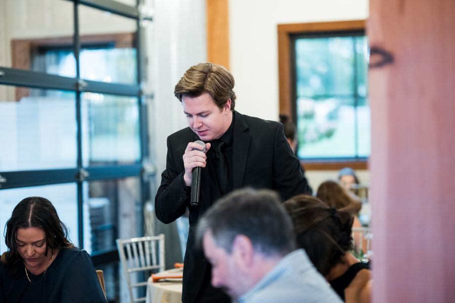 Reed performing a hypnosis show for reception guests